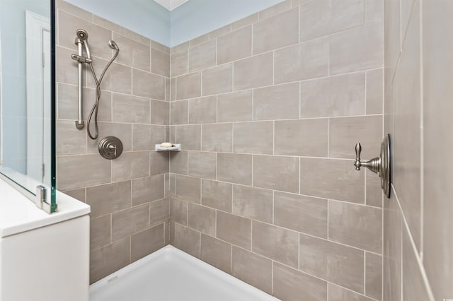 bathroom with tiled shower