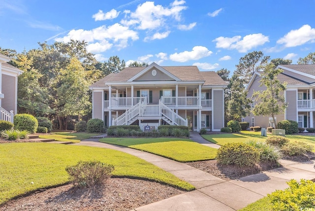 view of front of home featuring a porch and a front lawn