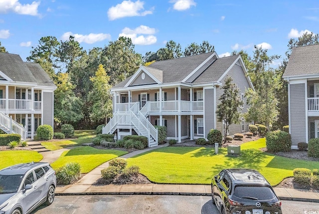 view of front of property with a front lawn and covered porch