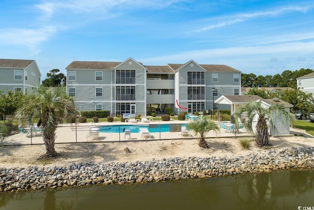 back of house with a water view