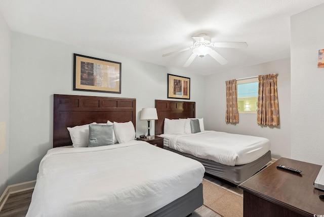 bedroom with ceiling fan and hardwood / wood-style flooring