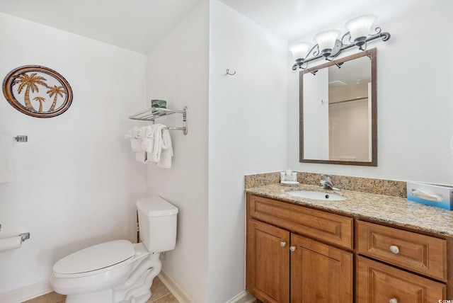 bathroom featuring vanity, toilet, and tile patterned floors