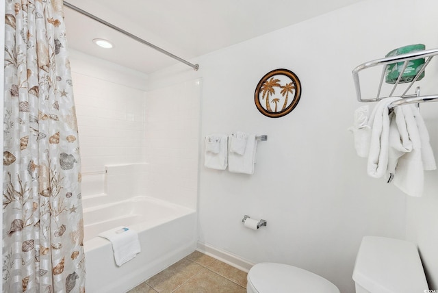 bathroom with shower / bathtub combination with curtain, tile patterned flooring, and toilet