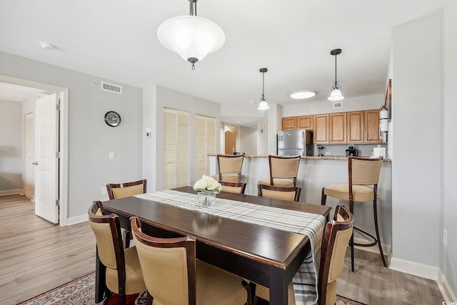 dining area featuring light hardwood / wood-style floors