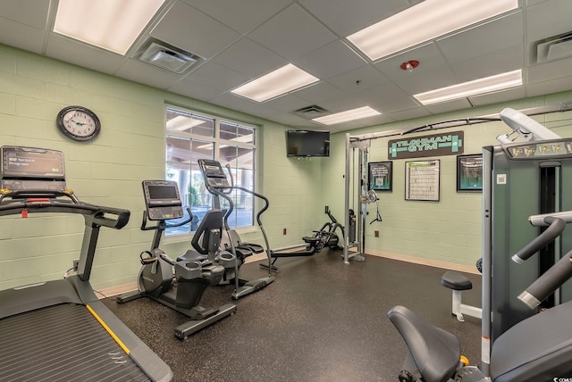 exercise room with a drop ceiling