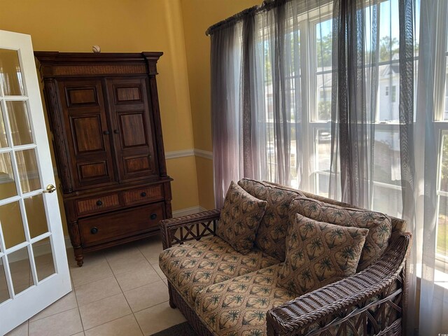 sitting room with light tile patterned floors