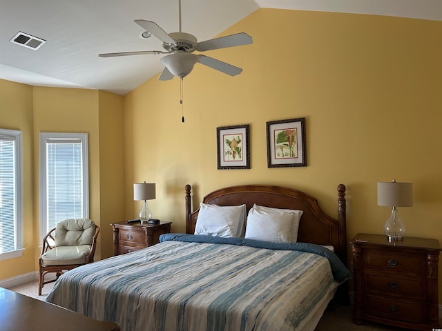 carpeted bedroom featuring ceiling fan and vaulted ceiling