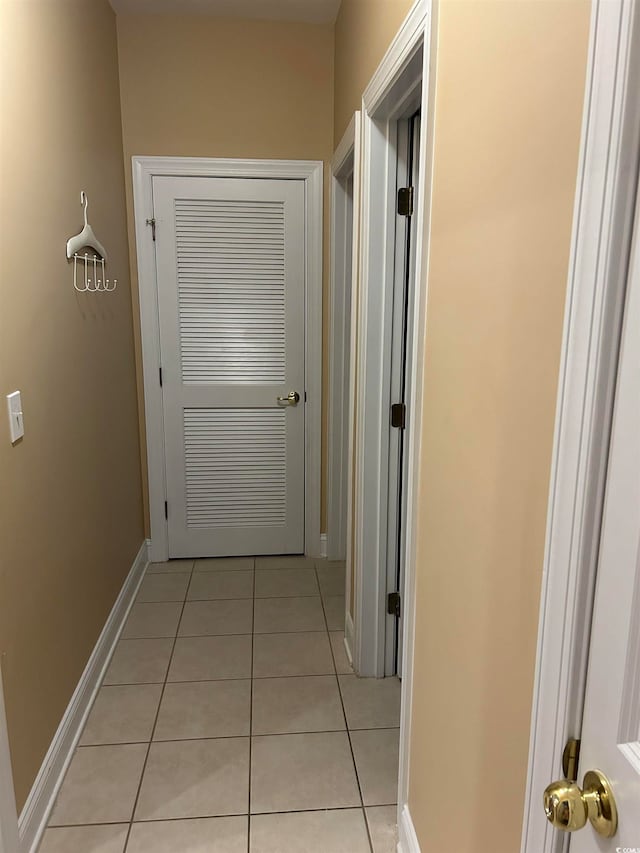 corridor featuring light tile patterned floors