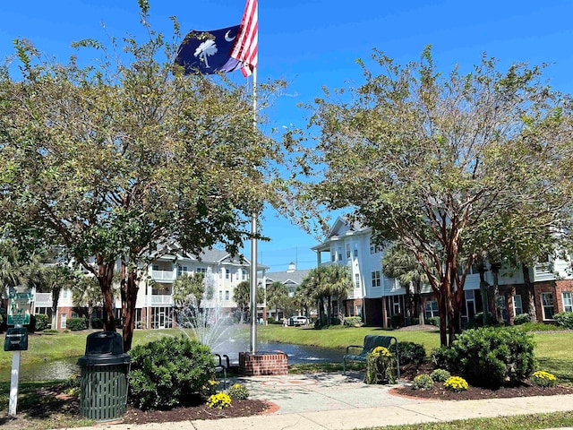 view of home's community featuring a yard