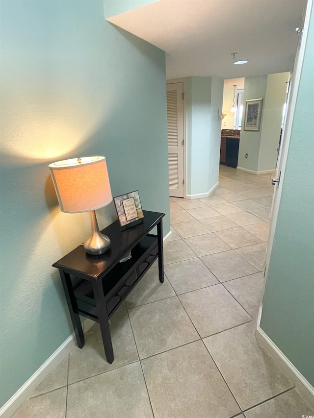 hallway with light tile patterned floors