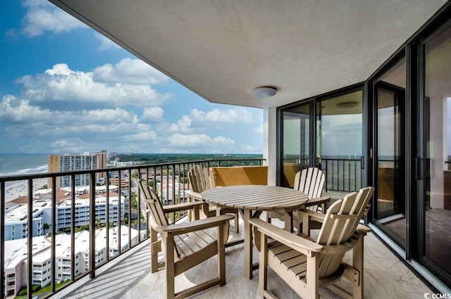 balcony featuring a water view