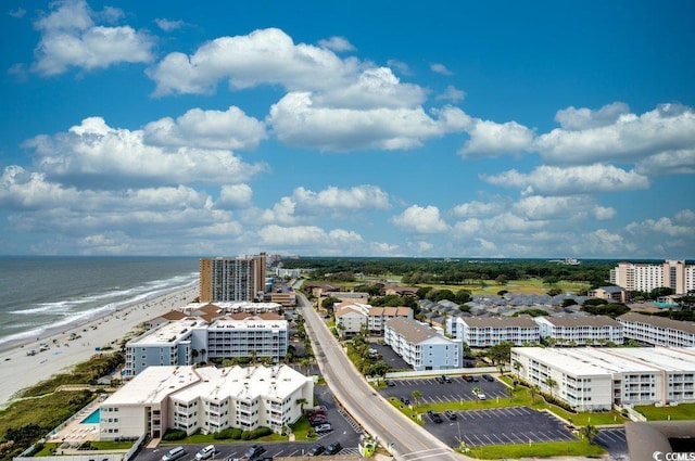 drone / aerial view featuring a view of the beach and a water view