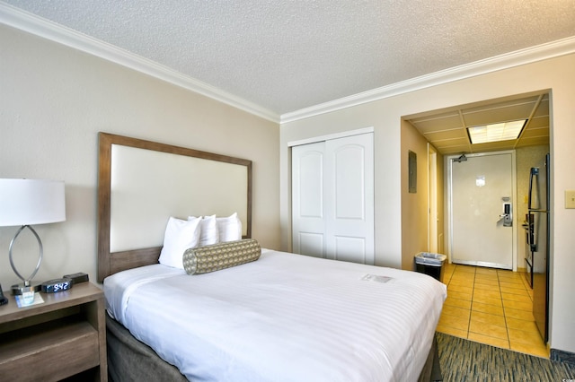 1105 S Ocean Blvd Unit 1044, Myrtle Beach, SC 29577 - bedroom with a closet, ornamental molding, a textured ceiling, and tile patterned flooring