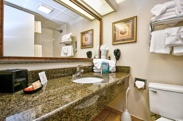 1105 S Ocean Blvd Unit 1044, Myrtle Beach, SC 29577 - full bathroom with toilet, tile patterned flooring, a shower with curtain, and vanity