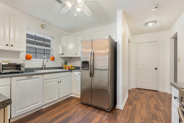 kitchen with ceiling fan, dark hardwood / wood-style flooring, stainless steel fridge with ice dispenser, and white cabinets