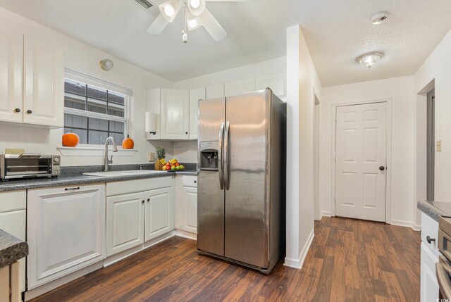 1356 Tranquility Ln, Myrtle Beach, SC 29577 - kitchen with stainless steel fridge with ice dispenser, dark wood-style floors, a ceiling fan, and white cabinets