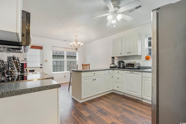1356 Tranquility Ln, Myrtle Beach, SC 29577 - kitchen featuring a peninsula, freestanding refrigerator, dark countertops, dark wood-style floors, and a ceiling fan