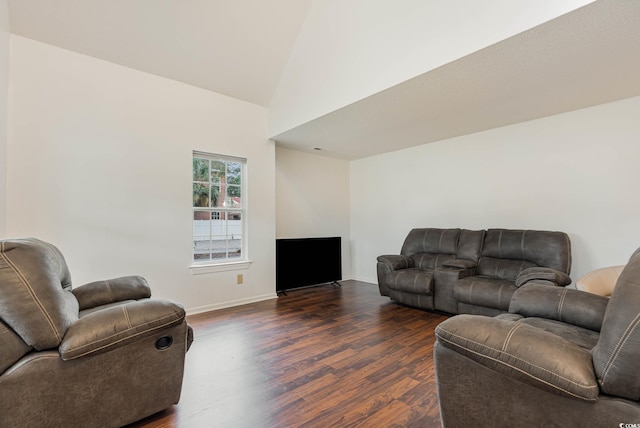 living room featuring dark hardwood / wood-style floors and high vaulted ceiling