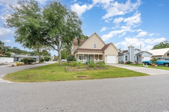 view of front of house featuring a front lawn and a garage