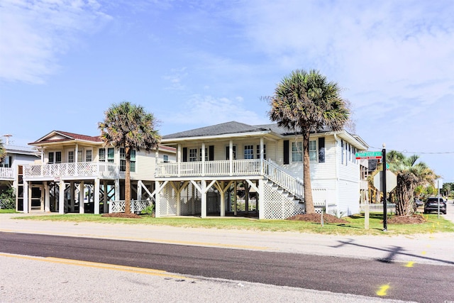 view of front of house with covered porch and a carport