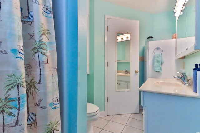 bathroom with vanity, toilet, and tile patterned floors