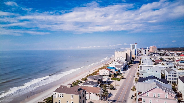 aerial view with a water view and a view of the beach