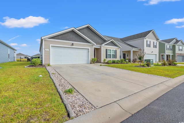 view of front of house with a garage and a front lawn