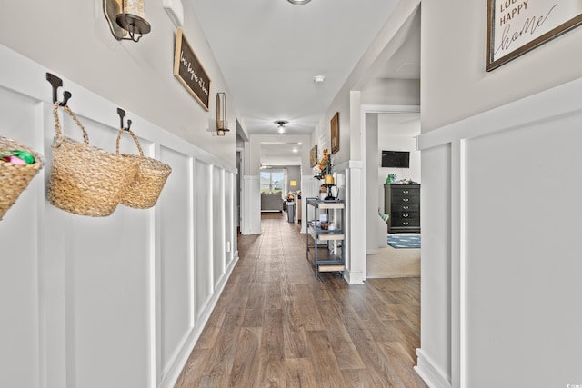 hall with hardwood / wood-style floors