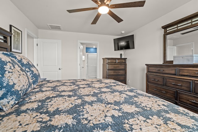 bedroom with ensuite bath and ceiling fan