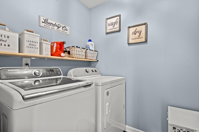 washroom with washing machine and clothes dryer