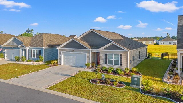 view of front facade with a garage and a front lawn