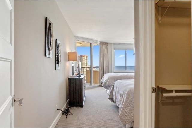 bedroom featuring light colored carpet