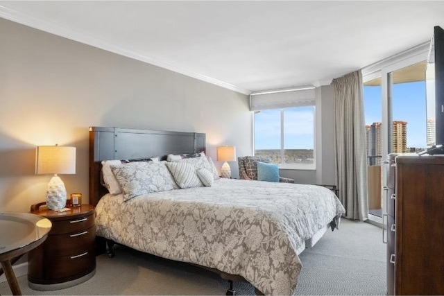 carpeted bedroom with crown molding