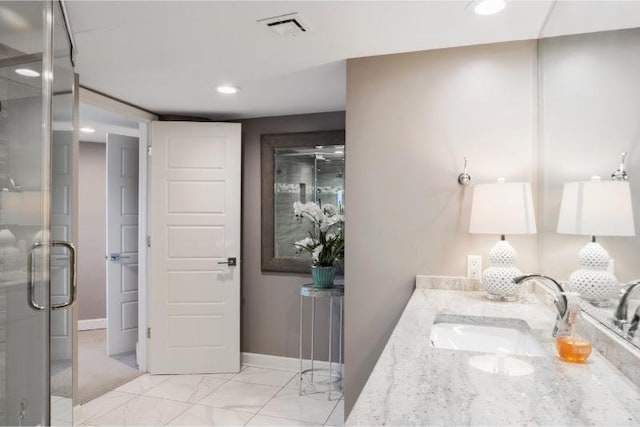 bathroom with vanity and an enclosed shower