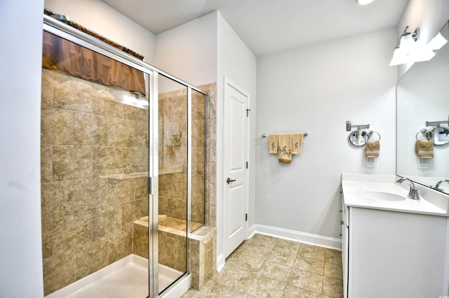 bathroom featuring vanity and an enclosed shower