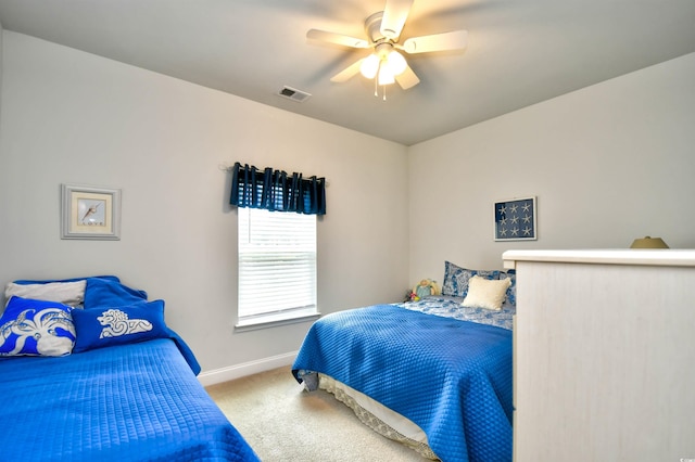 carpeted bedroom with ceiling fan