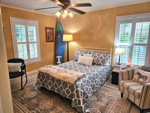 bedroom featuring crown molding, multiple windows, and ceiling fan