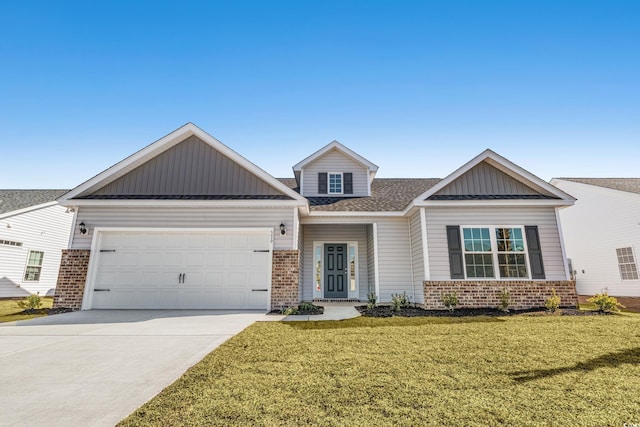 craftsman-style home featuring a garage and a front yard