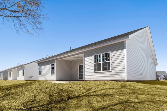 back of property featuring a patio, a yard, and ceiling fan