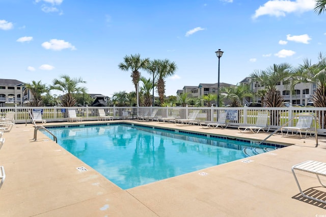 view of swimming pool featuring a patio