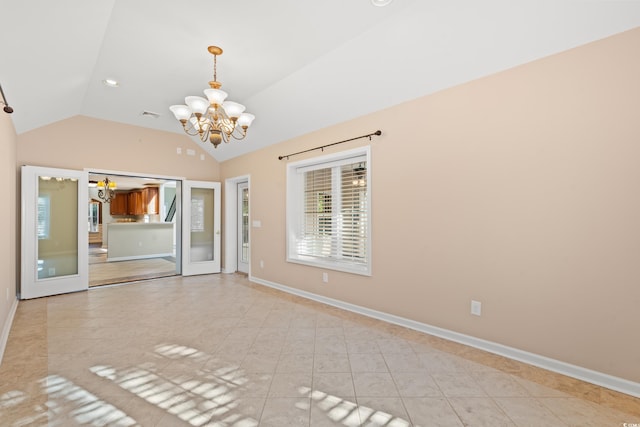 unfurnished room with light tile patterned floors, lofted ceiling, and a chandelier