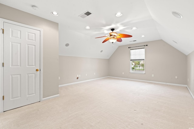 bonus room featuring lofted ceiling, ceiling fan, and light colored carpet