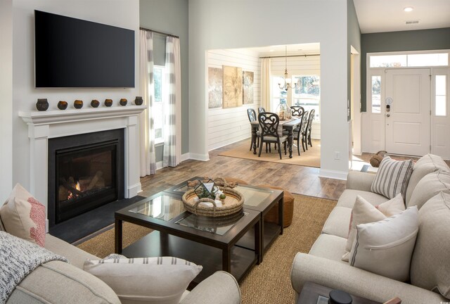 6088 Zoe Way, Myrtle Beach, SC 29588 - living room featuring light hardwood / wood-style floors and a chandelier