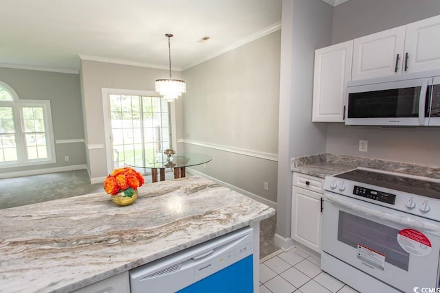 kitchen featuring white cabinetry, a chandelier, ornamental molding, decorative light fixtures, and white appliances