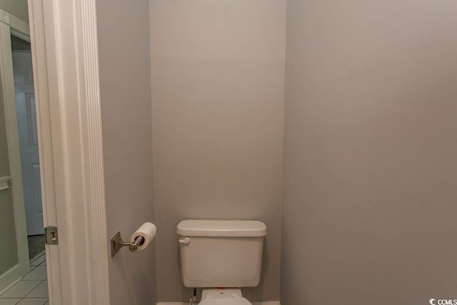 bathroom with tile patterned floors and toilet