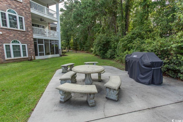 view of patio with a balcony and a grill