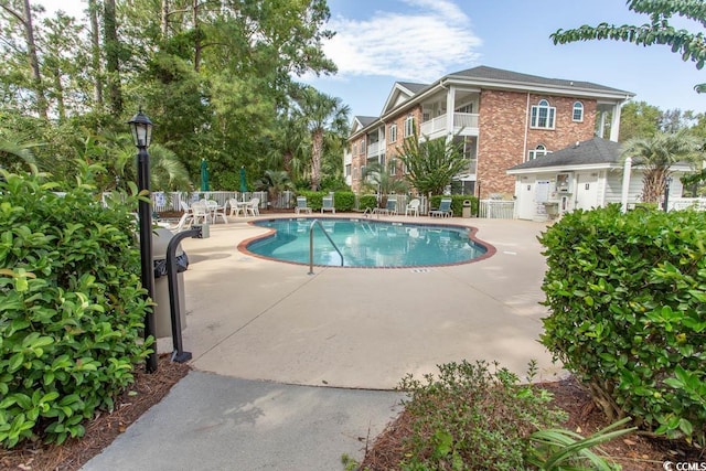 view of pool featuring a patio area