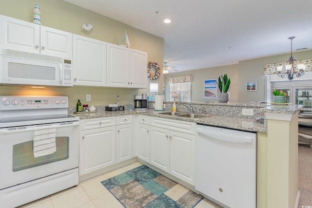 601 Hillside Dr N Unit 3906, North Myrtle Beach, SC 29582 - kitchen with white appliances, a peninsula, white cabinetry, a chandelier, and recessed lighting