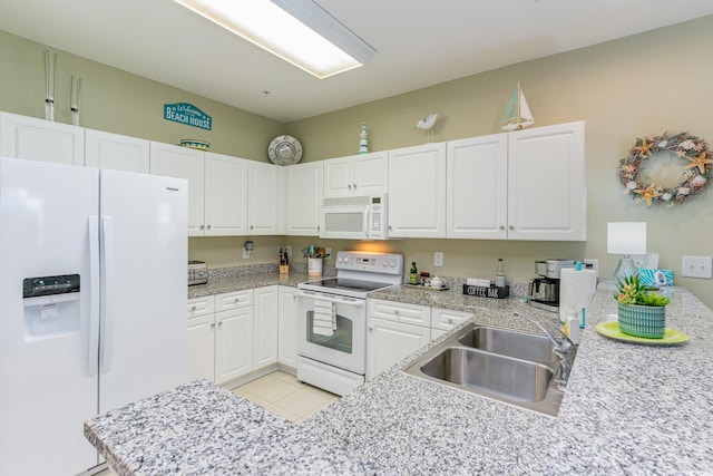 601 Hillside Dr N Unit 3906, North Myrtle Beach, SC 29582 - kitchen featuring white appliances, light countertops, white cabinets, and light tile patterned floors