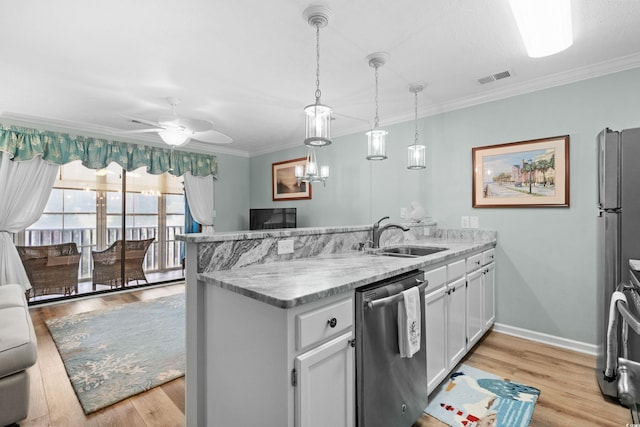 kitchen with white cabinets, ornamental molding, dishwasher, ceiling fan with notable chandelier, and light hardwood / wood-style floors